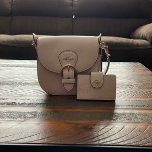Coach hand purse with matching wallet.